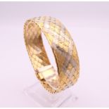 An 18 ct gold bracelet. 19 cm long. 49.9 grammes.