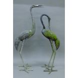 Two garden models of storks. The largest 82 cm high.