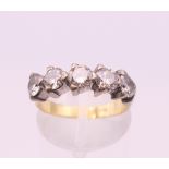An 18 ct gold five stone diamond ring. Each stone approximately .25 carat. Ring size K/L.