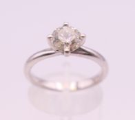 An 18 ct white gold diamond solitaire ring. Diamond weight approximately 1 carat. ring size N.