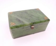 An Art Deco style spinach green jade box. 9 cm wide, 5.5 cm deep, 4 cm high.
