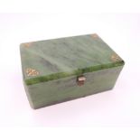 An Art Deco style spinach green jade box. 9 cm wide, 5.5 cm deep, 4 cm high.