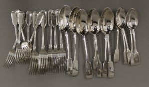 A six place setting of silver flatware. 1225.7 grammes.