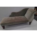 A Victorian green upholstered mahogany chaise lounge. Approximately 92 cm long.