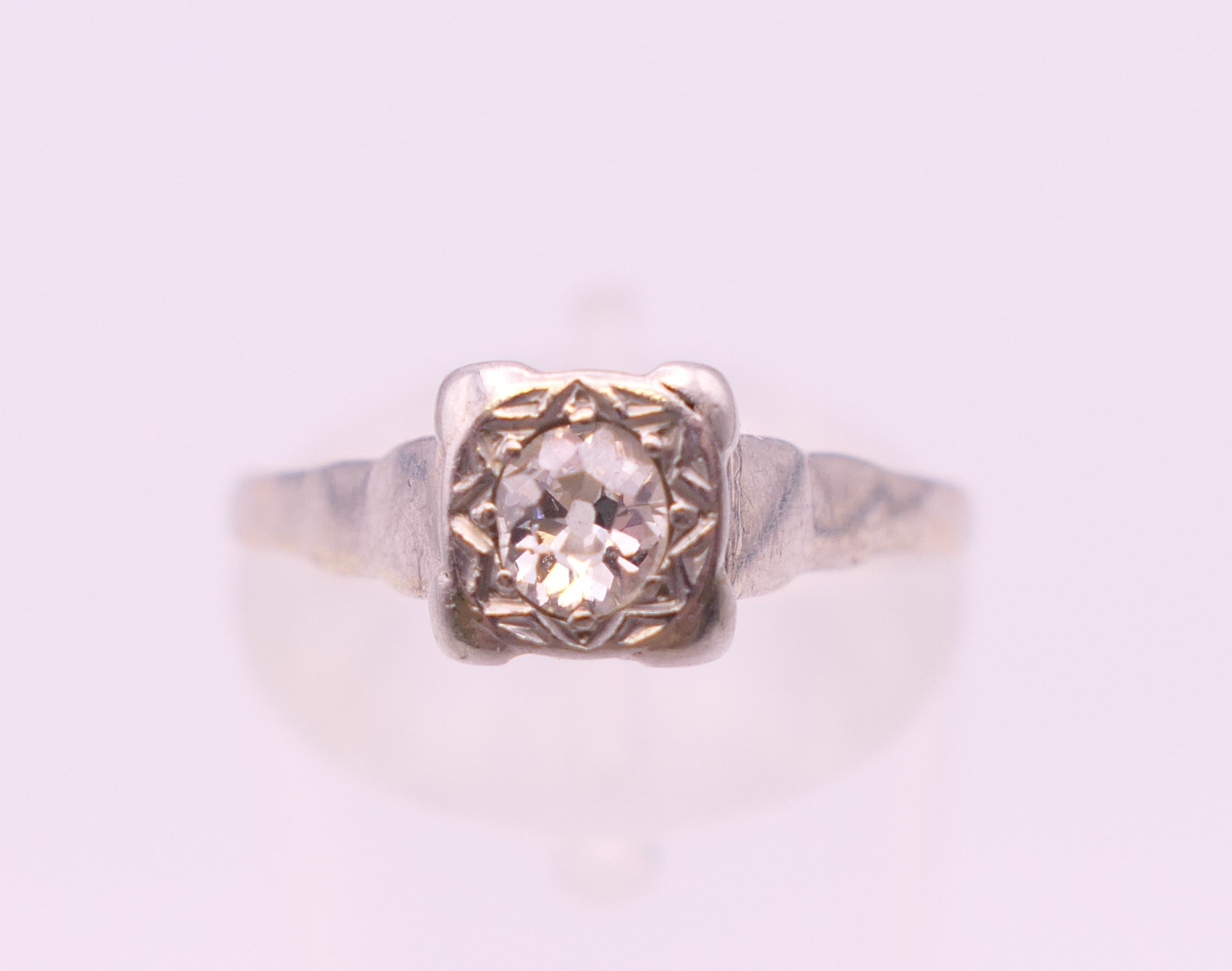 A platinum and 18 ct gold diamond solitaire ring. Ring size L/M. - Image 3 of 5