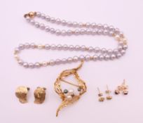 A quantity of 9 ct gold jewellery, including three pairs of earrings, a brooch and a necklace.