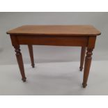 A mahogany side table. 90 cm long.