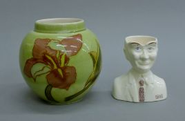 Two pieces of Carlton Ware - a vase and an egg cup. The former 11.5 cm high.