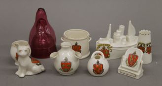A quantity of various Ely crested ware and two cranberry vessels.
