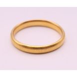 A 22 ct gold wedding band. Ring size X. 6.3 grammes.