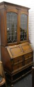 A 1930's oak bureau bookcase. 96 cm wide.