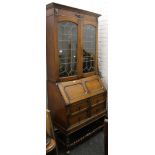 A 1930's oak bureau bookcase. 96 cm wide.