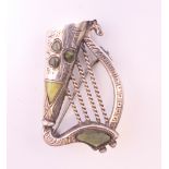 A silver brooch formed as a harp. 3.5 cm high.