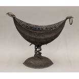 A large Indian embossed silver centre piece. 42 cm wide. 1849.3 grammes.
