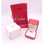 A Cartier 18 ct white gold 'Love' ring set with six diamonds, boxed. Ring size S.