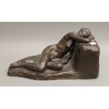 A plaster sculpture of a sleeping naked lady. 43 cm long.
