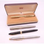 Two Cross fountain pens, one with 14 K gold nib,