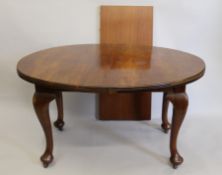 An early 20th century mahogany single leaf extending dining table.