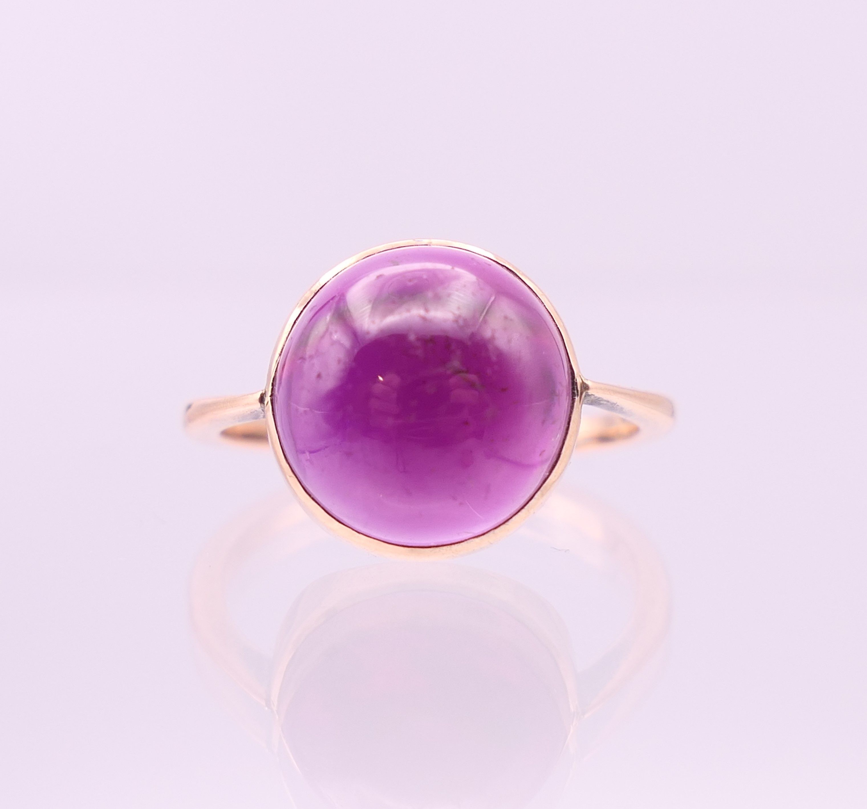 A 9 ct gold cabochon amethyst ring. Ring size N/O. - Image 2 of 7