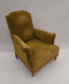 A late 19th/early 20th century green upholstered armchair. 82 cm wide.