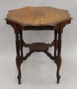 A Victorian walnut centre table.