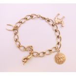 A 9 ct gold charm bracelet. 21 cm long. 25.7 grammes.