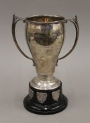 A silver twin handled trophy cup on stand. 24 cm high overall. 366.8 grammes.