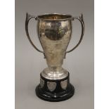 A silver twin handled trophy cup on stand. 24 cm high overall. 366.8 grammes.