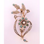 A 9 ct gold turquoise and pearl brooch. 5 cm high. 4.5 grammes total weight.