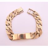 A 9 ct gold identity bracelet. 20 cm long. 60 grammes.