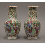 A pair of 19th century Canton famille rose vases. 22 cm high.