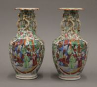 A pair of 19th century Canton famille rose vases. 22 cm high.