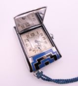 An Art Deco purse watch. 4.5 x 3 cm.