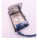 An Art Deco purse watch. 4.5 x 3 cm.