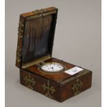 A 19th century brass mounted walnut cased travelling clock. The case 9 cm wide.