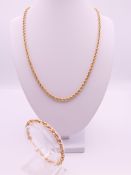A 9 ct gold rope twist necklace and bracelet. Necklace 50 cm long, bracelet 17.5 cm long. 9.