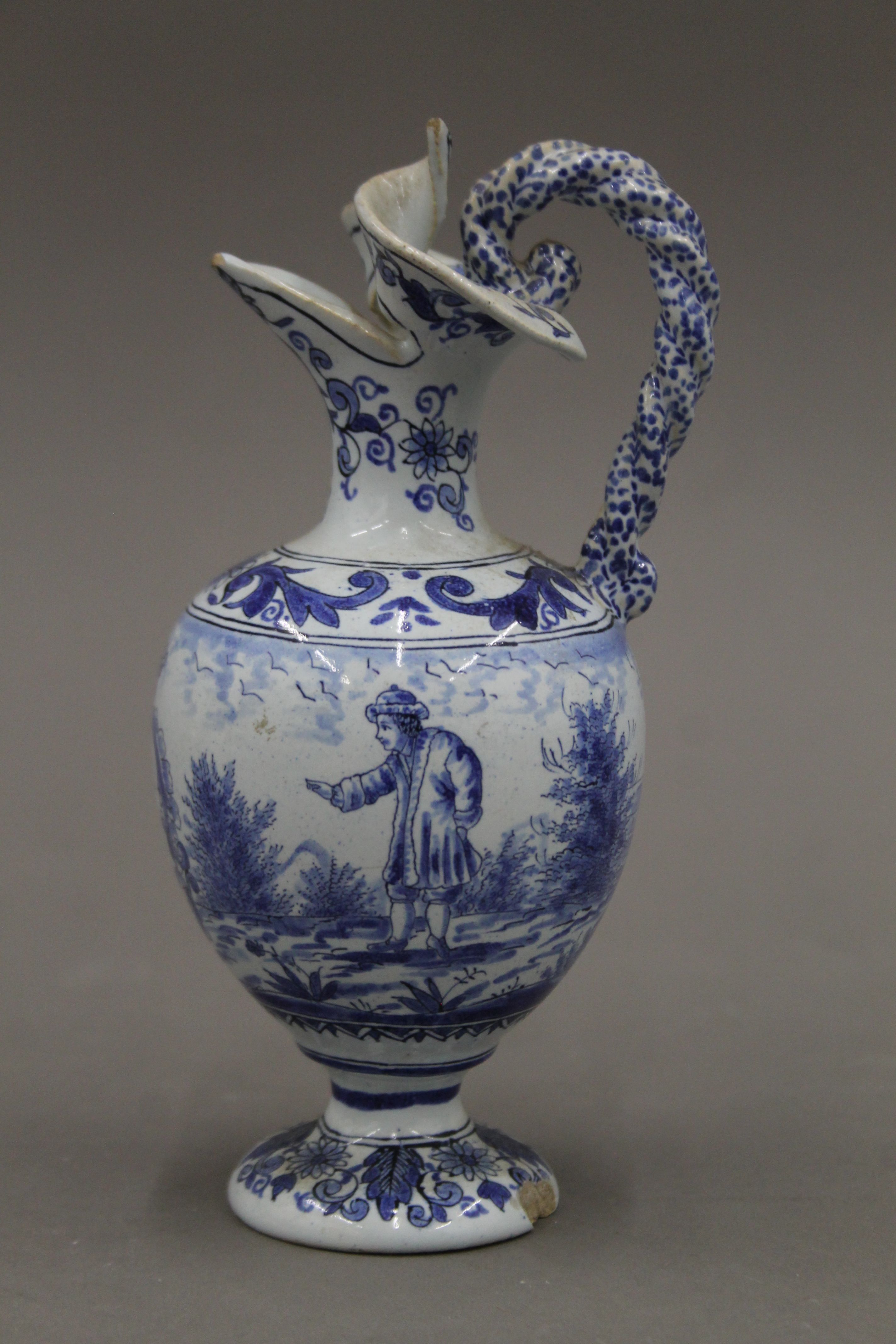 A pair of small 19th century blue and white ewers. 17.5 cm high. - Image 5 of 6