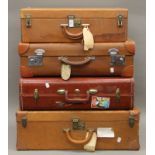 Four vintage suitcases. The largest 66 cm wide.