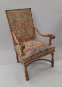 A 19th century tapestry covered walnut open armchair. 67 cm wide.