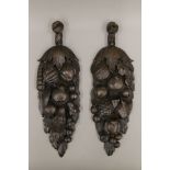A pair of Victorian oak carvings. 43 cm high.