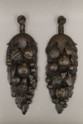 A pair of Victorian oak carvings. 43 cm high.