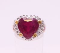 A silver heart shaped ring. Ring size P.