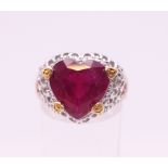 A silver heart shaped ring. Ring size P.