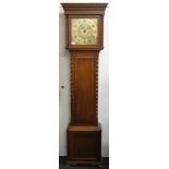 An oak barley twist longcase clock. 198 cm high.