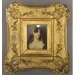 A print of a lady, housed in a 19th century gilt frame. 7 x 9 cm.