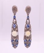 A pair of opal, diamond and sapphire earrings. 5.75 cm high.