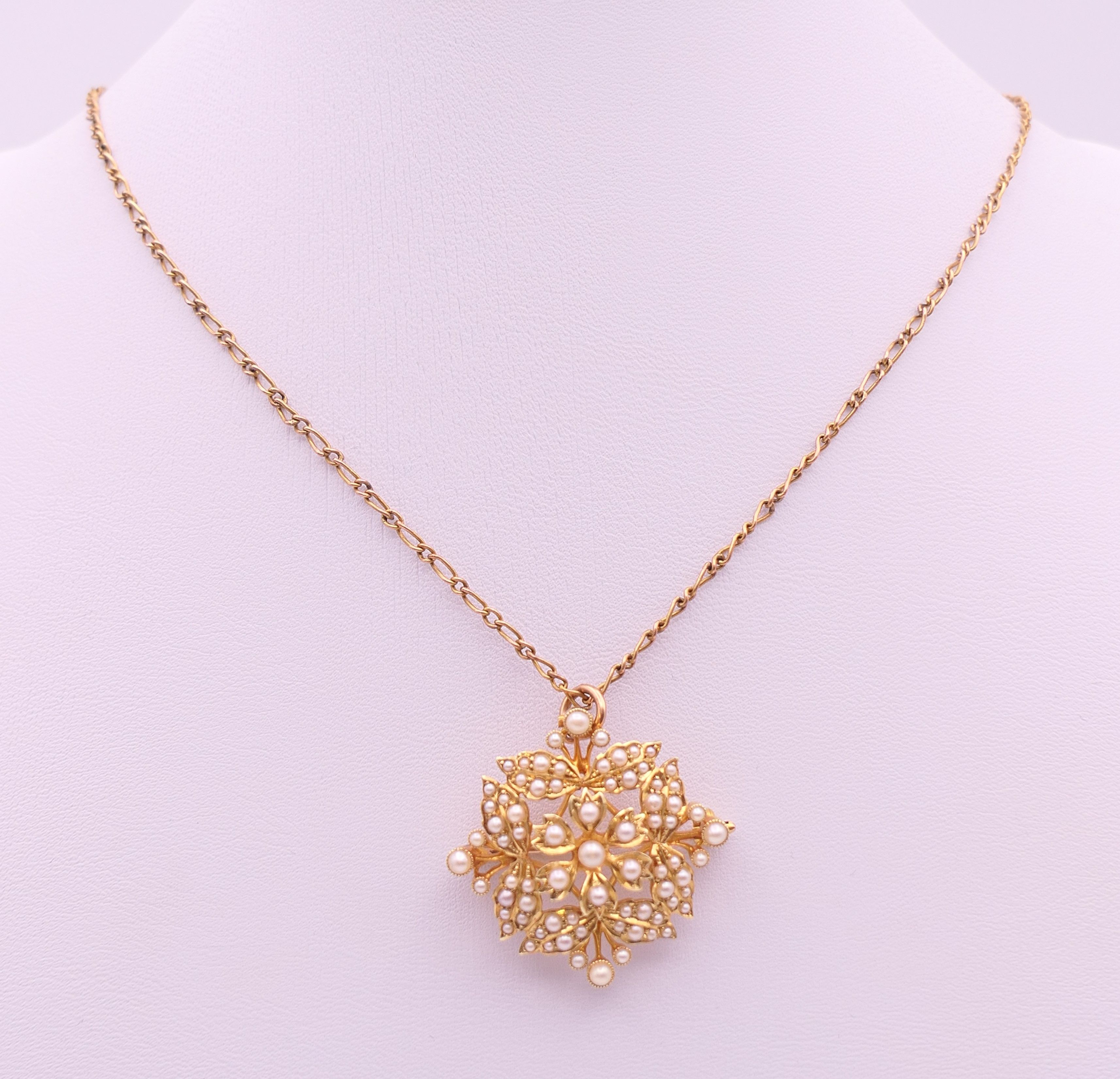 A 15 ct gold and seed pearl pendant/brooch on a 9 ct gold chain. - Image 8 of 9