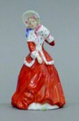 A Royal Doulton figurine, Christmas Morn, HN3212.