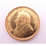 A 1985 1/10 gold Krugerrand. 3.4 grammes.