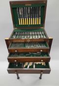 An oak cutlery chest on stand, containing silver plated cutlery. 48 cm wide.